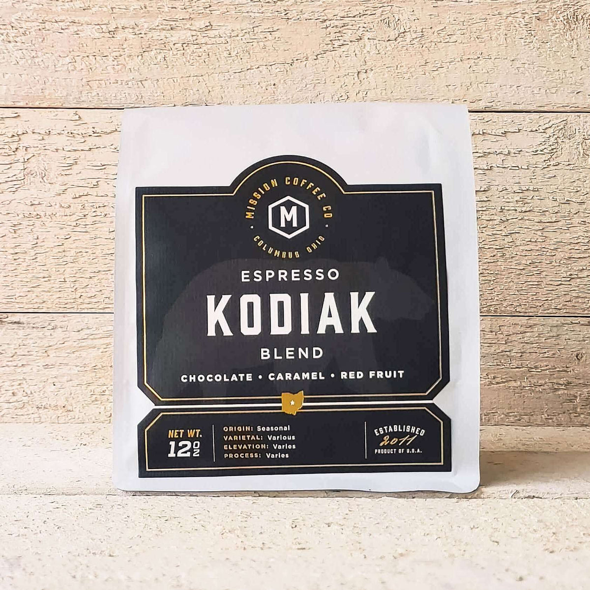 A white bag of coffee beans from Rosso Coffee Roasters